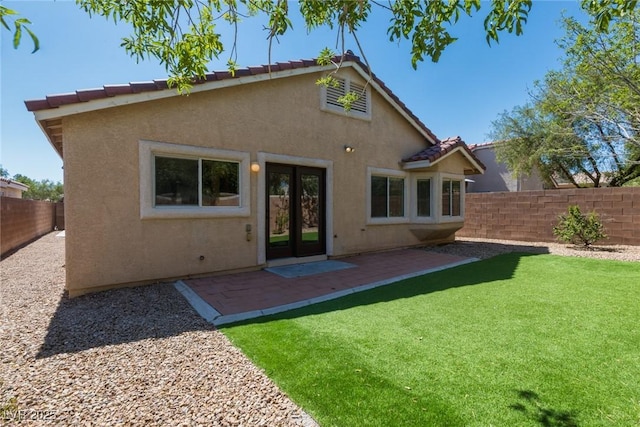 6740 Arctic Breeze St, North Las Vegas, NV 89084 - rear view of house featuring stucco siding, a fenced backyard, a patio area, and a tile roof