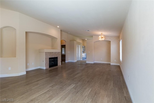 6740 Arctic Breeze St, North Las Vegas, NV 89084 - unfurnished living room featuring wood finished floors, a fireplace, and recessed lighting