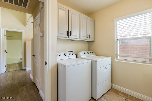 6740 Arctic Breeze St, North Las Vegas, NV 89084 - laundry room featuring separate washer and dryer and cabinet space