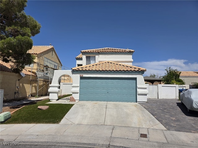 332 Dockside Ct, Las Vegas, NV 89145 - mediterranean / spanish home featuring a tile roof, stucco siding, concrete driveway, and a gate