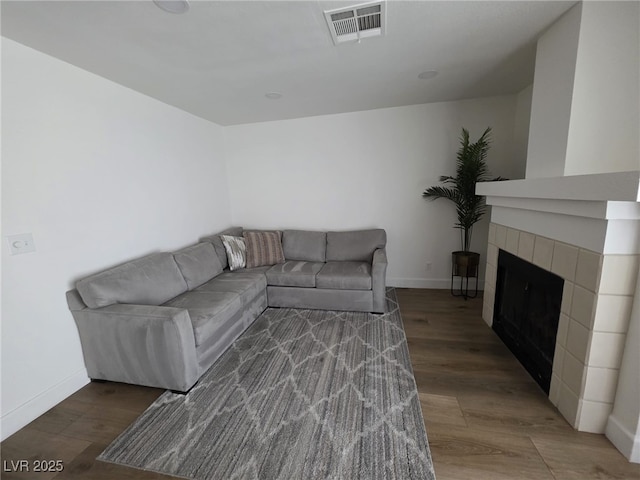 332 Dockside Ct, Las Vegas, NV 89145 - living room with wood finished floors and a tiled fireplace