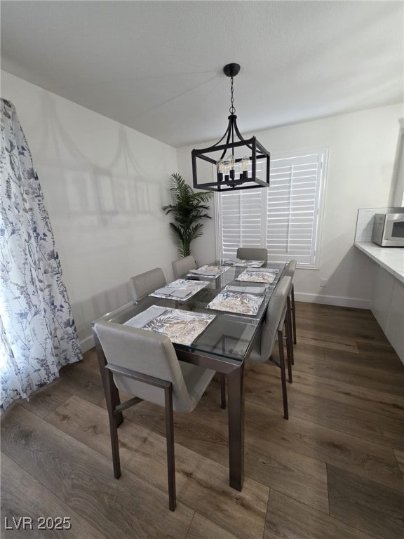 332 Dockside Ct, Las Vegas, NV 89145 - dining area with a chandelier and wood finished floors