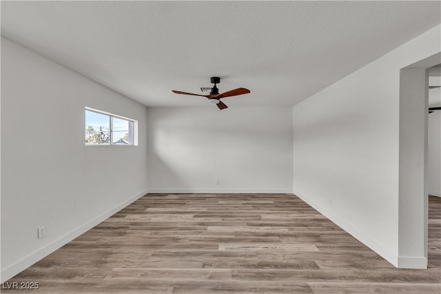 5617 Reiter Ave, Las Vegas, NV 89108 - empty room with a ceiling fan and wood finished floors