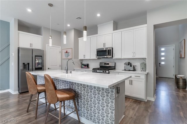 2530 Catallo St, Henderson, NV 89044 - kitchen with appliances with stainless steel finishes, backsplash, dark wood-type flooring, and recessed lighting