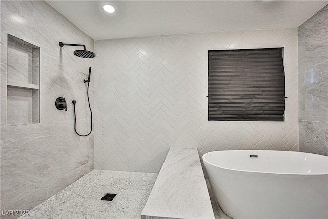 9340 W Washburn Rd, Las Vegas, NV 89149 - full bath featuring a freestanding bath, tile walls, and tiled shower