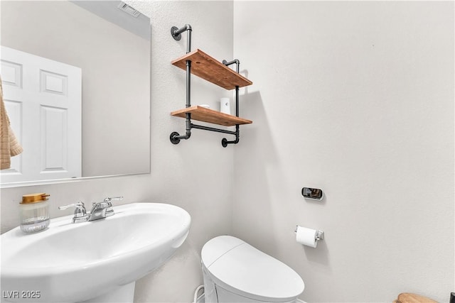 4332 Stardusk Falls Ave, North Las Vegas, NV 89084 - half bathroom featuring a sink and toilet