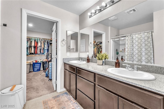 4332 Stardusk Falls Ave, North Las Vegas, NV 89084 - full bath with a walk in closet, double vanity, and a shower with shower curtain
