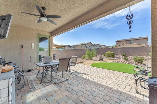 4332 Stardusk Falls Ave, North Las Vegas, NV 89084 - fenced backyard with outdoor dining area, a patio area, and ceiling fan