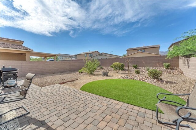 4332 Stardusk Falls Ave, North Las Vegas, NV 89084 - fenced backyard with a patio area and area for grilling