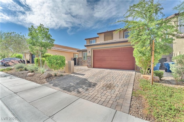 4332 Stardusk Falls Ave, North Las Vegas, NV 89084 - view of front of property featuring stucco siding, decorative driveway, and an attached garage