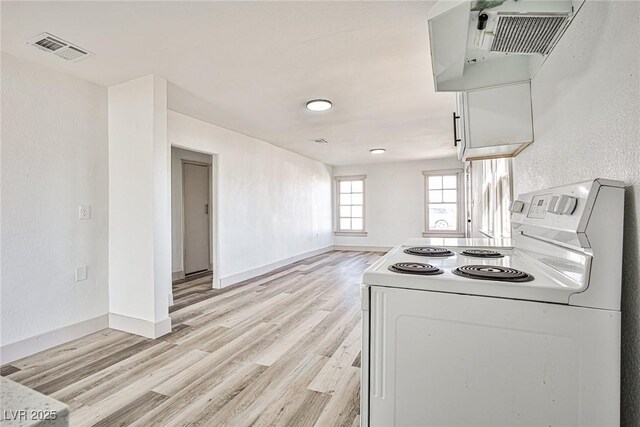 603 W Adams Ave, Las Vegas, NV 89106 - kitchen featuring electric range, washer / clothes dryer, and light wood-style flooring