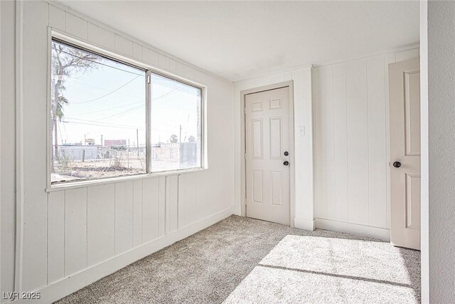 603 W Adams Ave, Las Vegas, NV 89106 - carpeted foyer entrance featuring healthy amount of natural light and a decorative wall