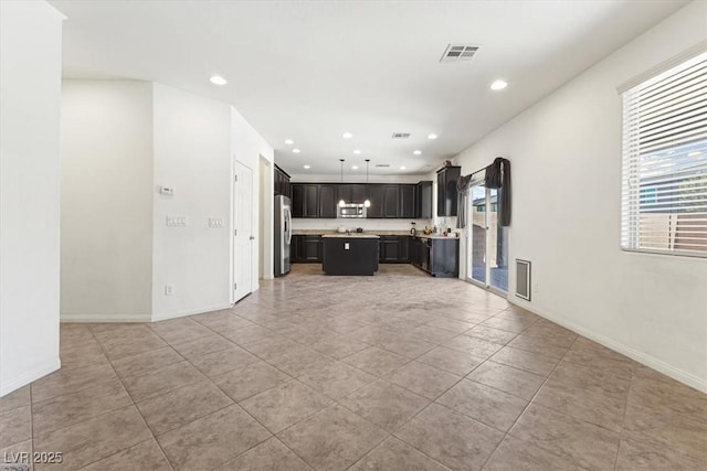 9268 Wildfire Gorge St, Las Vegas, NV 89139 - unfurnished living room featuring recessed lighting and light tile patterned flooring