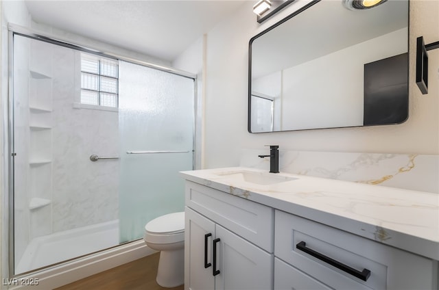 5617 Alfred Dr, Las Vegas, NV 89108 - full bath with vanity, a stall shower, and wood finished floors