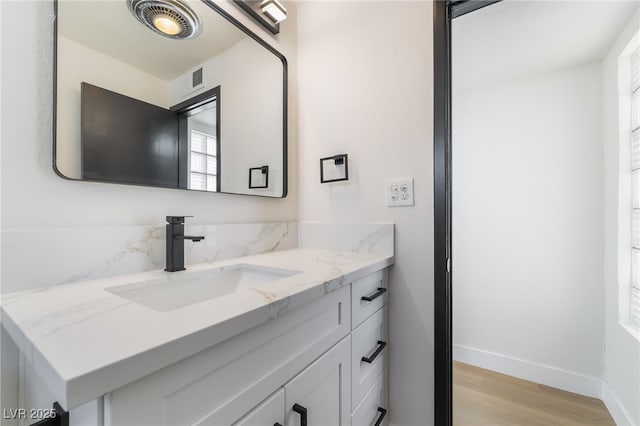5617 Alfred Dr, Las Vegas, NV 89108 - bathroom with wood finished floors and vanity