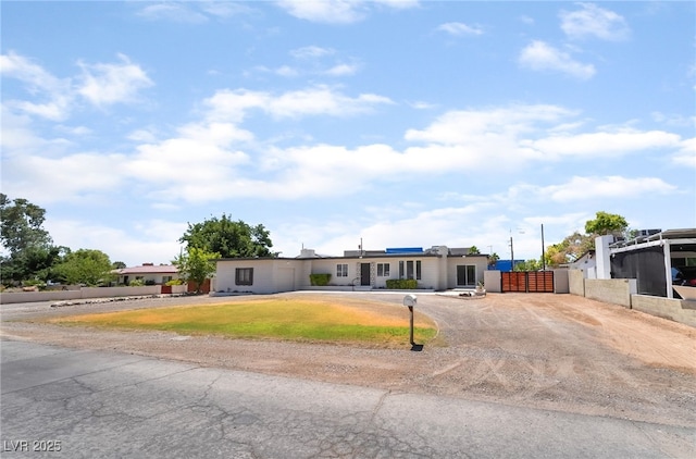 5617 Alfred Dr, Las Vegas, NV 89108 - view of front facade with driveway and a gate
