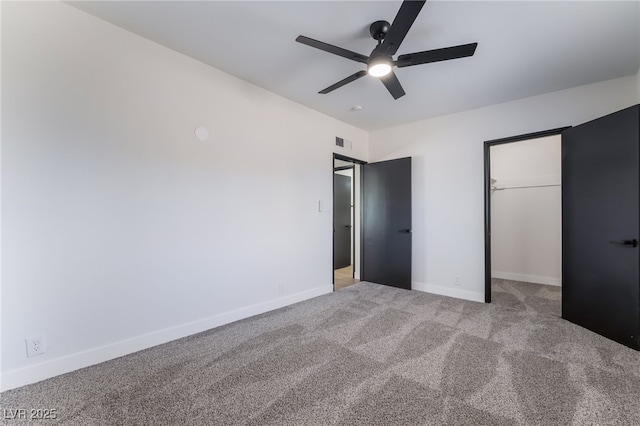 5617 Alfred Dr, Las Vegas, NV 89108 - unfurnished bedroom featuring a walk in closet, carpet flooring, ceiling fan, and a closet