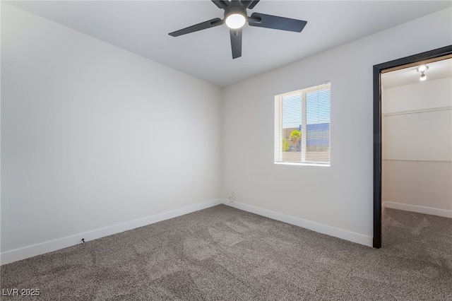 5617 Alfred Dr, Las Vegas, NV 89108 - unfurnished bedroom with carpet flooring, a walk in closet, and ceiling fan