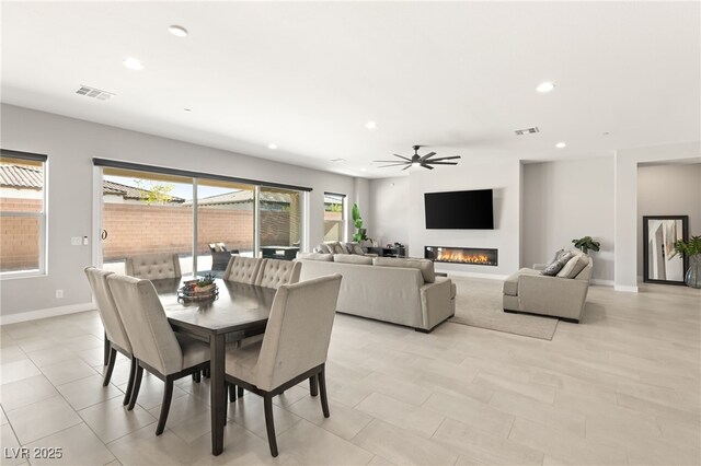 8575 Nicholas James Ave, Las Vegas, NV 89143 - dining area featuring recessed lighting, ceiling fan, and a glass covered fireplace