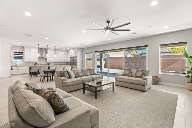 8575 Nicholas James Ave, Las Vegas, NV 89143 - living area featuring recessed lighting, healthy amount of natural light, a ceiling fan, and light tile patterned floors