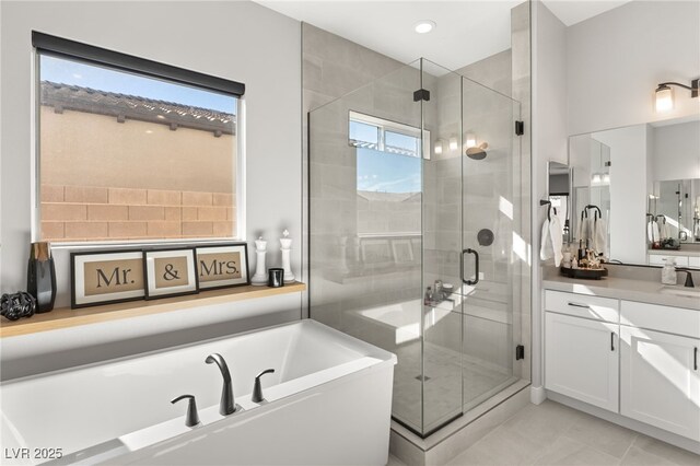 8575 Nicholas James Ave, Las Vegas, NV 89143 - bathroom featuring vanity, a bath, a shower stall, tile patterned floors, and recessed lighting