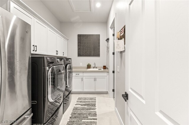 8575 Nicholas James Ave, Las Vegas, NV 89143 - laundry area featuring washer and clothes dryer, cabinet space, and attic access