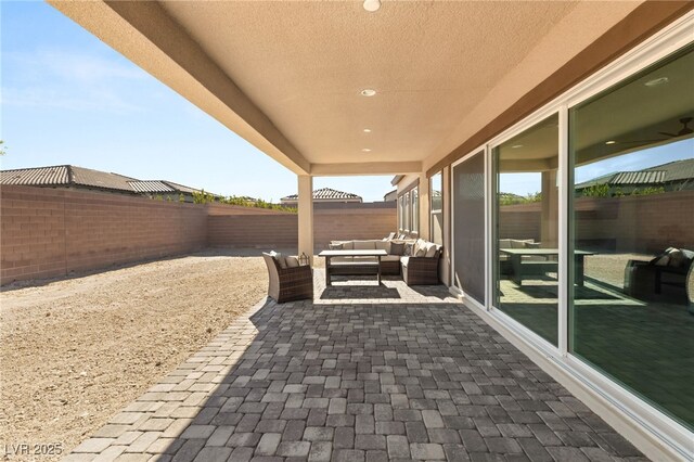 8575 Nicholas James Ave, Las Vegas, NV 89143 - fenced backyard with outdoor lounge area and a patio area