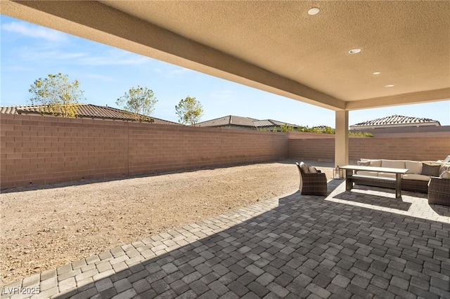 8575 Nicholas James Ave, Las Vegas, NV 89143 - fenced backyard with an outdoor hangout area and a patio area
