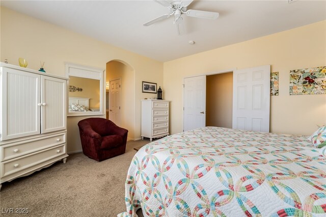 532 Kavanagh Pl, Las Vegas, NV 89123 - bedroom with light carpet, arched walkways, and a ceiling fan