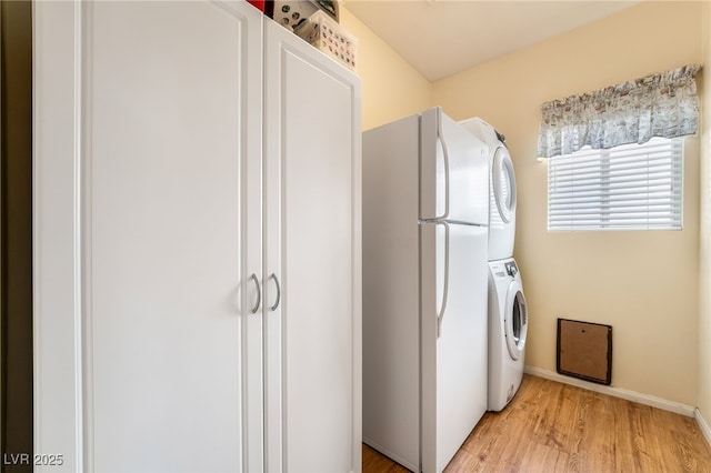 532 Kavanagh Pl, Las Vegas, NV 89123 - laundry room featuring stacked washer / dryer and light wood-style flooring