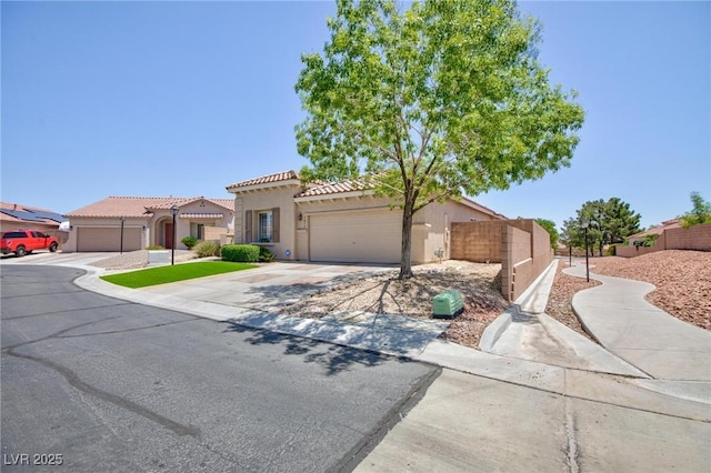 7816 Glowing Peak St, Las Vegas, NV 89131 - mediterranean / spanish house with driveway, a tile roof, stucco siding, and an attached garage