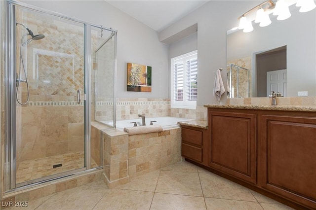 7816 Glowing Peak St, Las Vegas, NV 89131 - bathroom featuring vanity, a garden tub, tile patterned floors, and a stall shower