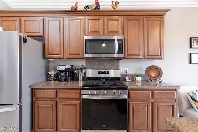 7816 Glowing Peak St, Las Vegas, NV 89131 - kitchen with stainless steel appliances, brown cabinets, and light stone counters