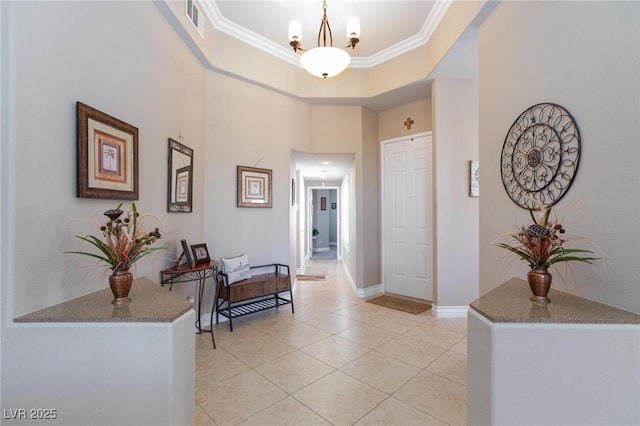 7816 Glowing Peak St, Las Vegas, NV 89131 - corridor with crown molding, light tile patterned flooring, a chandelier, and a high ceiling