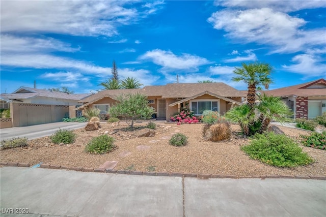 2009 E Oakey Blvd, Las Vegas, NV 89104 - ranch-style home featuring an attached garage, concrete driveway, and stucco siding