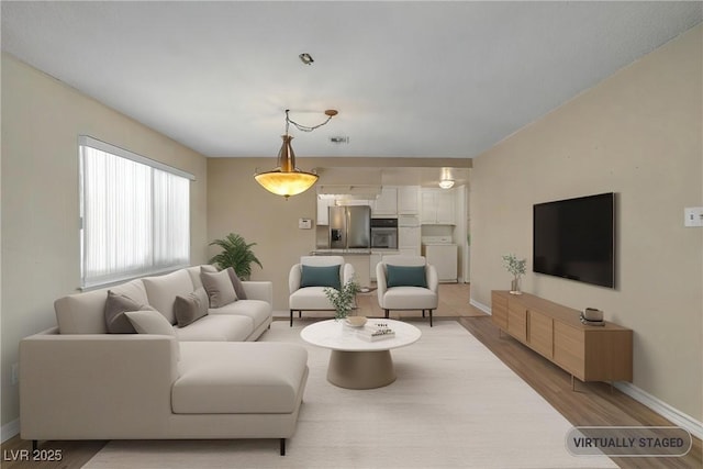2009 E Oakey Blvd, Las Vegas, NV 89104 - living area with baseboards and light wood finished floors