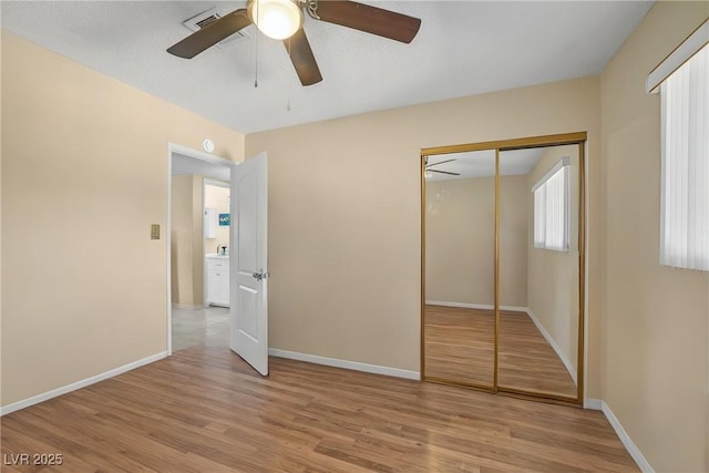 2009 E Oakey Blvd, Las Vegas, NV 89104 - unfurnished bedroom with light wood finished floors, a closet, and ceiling fan