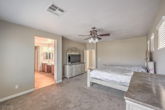 4016 Gaster Ave, North Las Vegas, NV 89081 - carpeted bedroom with ceiling fan and connected bathroom