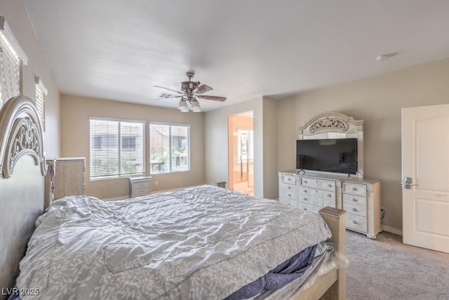 4016 Gaster Ave, North Las Vegas, NV 89081 - bedroom featuring light carpet, ceiling fan, and connected bathroom