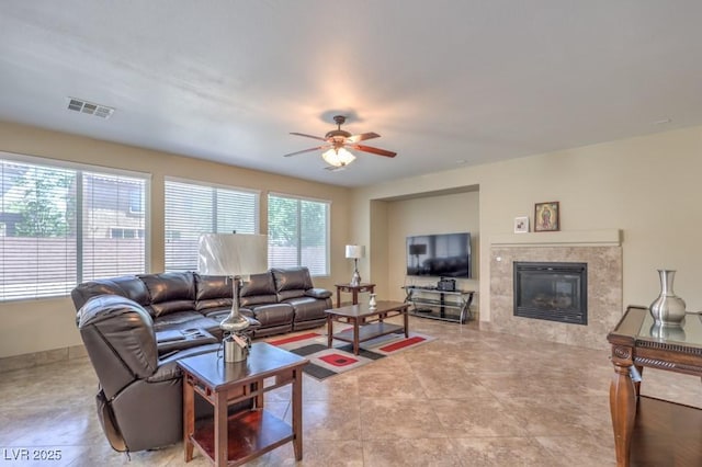 4016 Gaster Ave, North Las Vegas, NV 89081 - living area with a ceiling fan and a tile fireplace