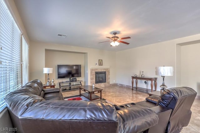 4016 Gaster Ave, North Las Vegas, NV 89081 - tiled living area featuring a ceiling fan and a tiled fireplace