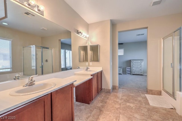 4016 Gaster Ave, North Las Vegas, NV 89081 - full bath featuring a shower stall, double vanity, and tile patterned floors