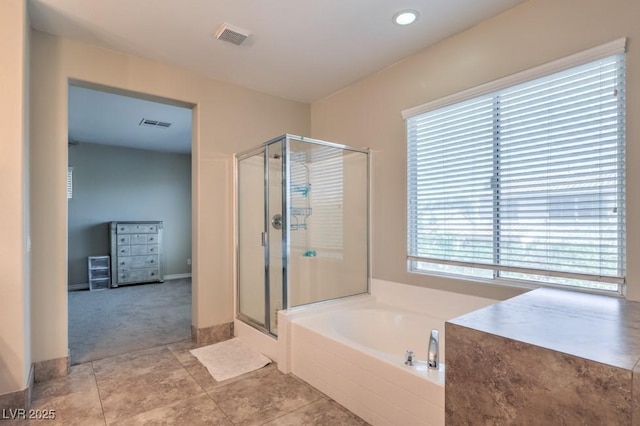 4016 Gaster Ave, North Las Vegas, NV 89081 - full bathroom with a stall shower, a garden tub, tile patterned flooring, and recessed lighting