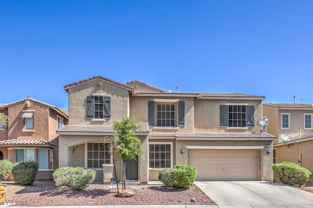 4016 Gaster Ave, North Las Vegas, NV 89081 - traditional home featuring stucco siding, an attached garage, driveway, and a tile roof