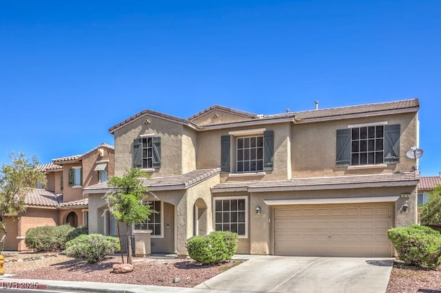 4016 Gaster Ave, North Las Vegas, NV 89081 - view of front of property with stucco siding, a tile roof, a garage, and concrete driveway