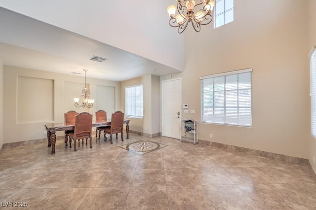 4016 Gaster Ave, North Las Vegas, NV 89081 - dining room featuring a chandelier, healthy amount of natural light, and a towering ceiling