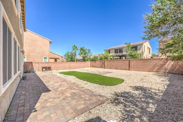 4016 Gaster Ave, North Las Vegas, NV 89081 - fenced backyard with a patio area