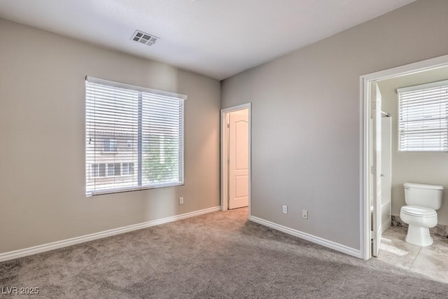 4016 Gaster Ave, North Las Vegas, NV 89081 - unfurnished bedroom featuring carpet flooring and connected bathroom