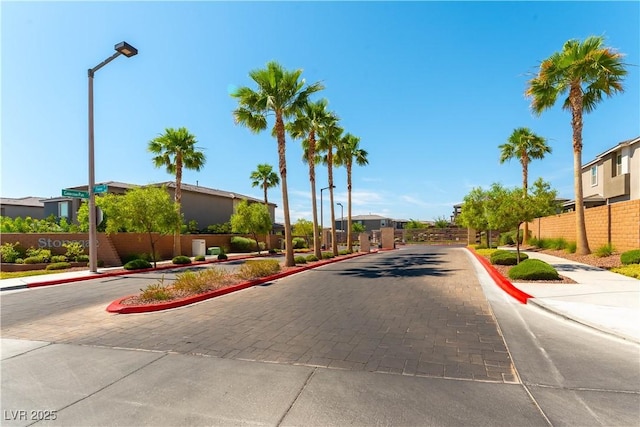 10711 Silver Pond Ave, Las Vegas, NV 89135 - view of road with sidewalks, curbs, and street lighting