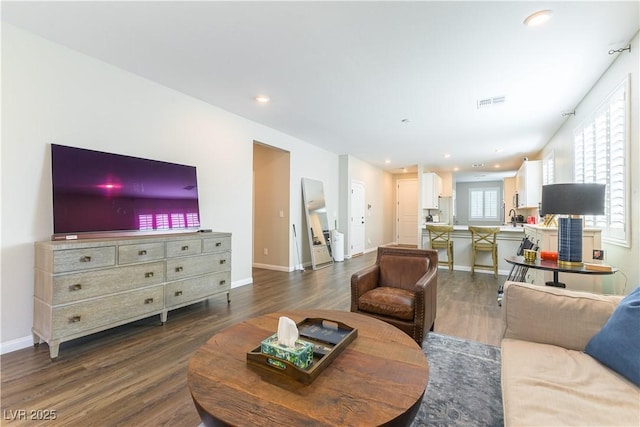 10711 Silver Pond Ave, Las Vegas, NV 89135 - living room featuring dark wood-type flooring and recessed lighting